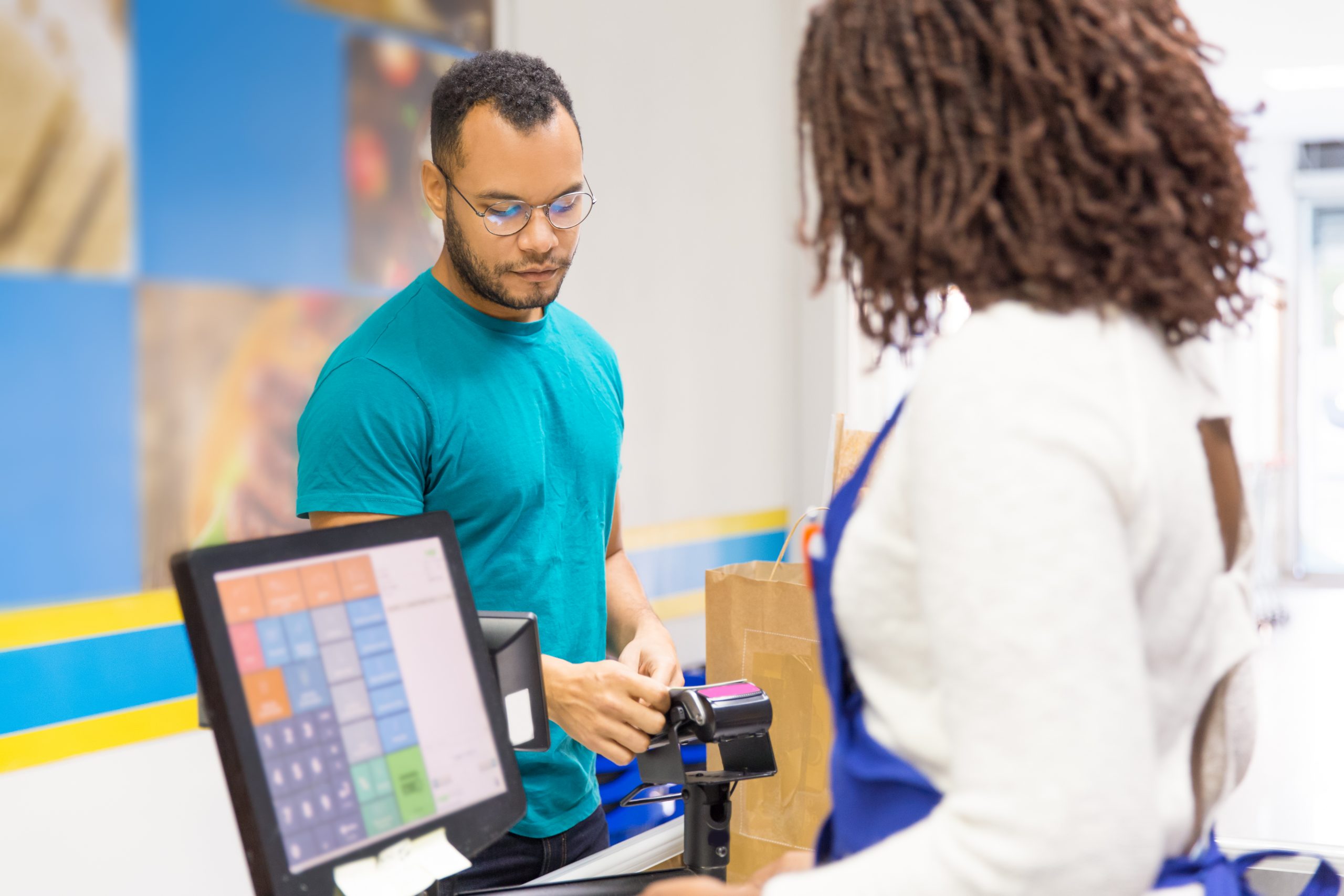 A man making a purchase in a store